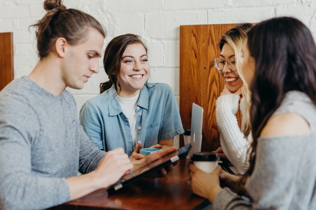 Group of workmates collaborating happily