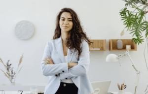 a confident woman standing in a formal workplace setting
