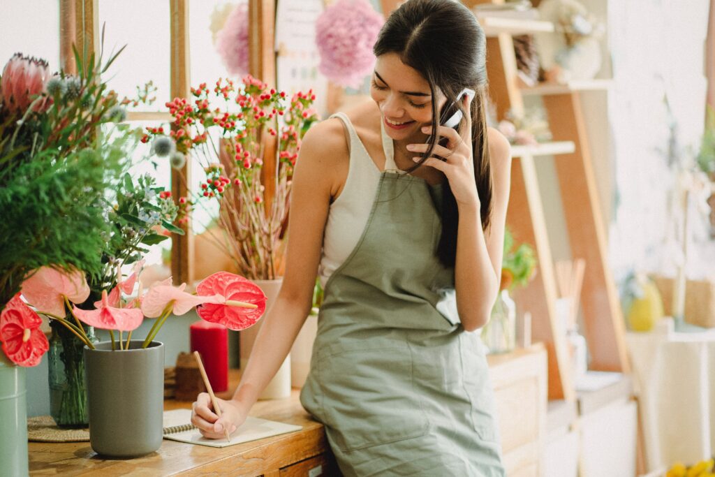 A woman happy and comfortable talking on the phone.