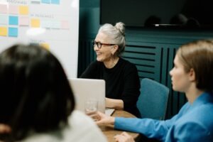 woman smiling with her coworkers