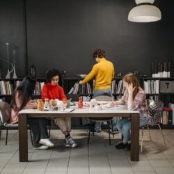 colleagues working at the same desk togther
