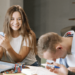 three people collaborating around a desk