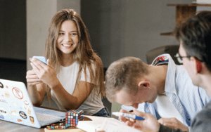 three people collaborating around a desk