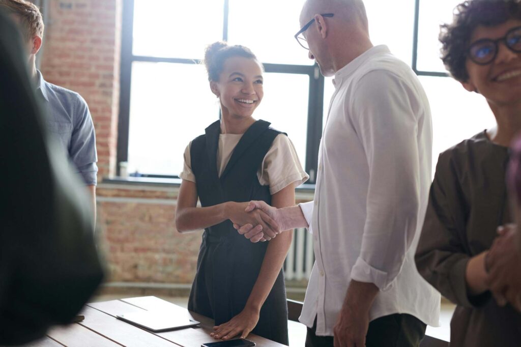 man and woman shaking hands