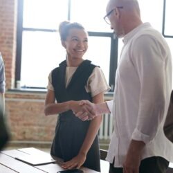 man and woman shaking hands